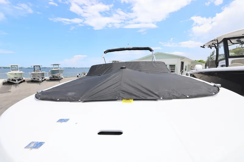 Slide: The Image of 2026 Hurricane SunDeck 2050 OB boat with open hatch and ladder on deck. - 14