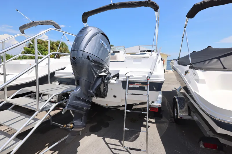 Slide: The Image of 2026 Hurricane SunDeck 2050 OB boat interior with spacious seating and modern design. - 19