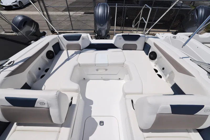 Slide: The Image of 2026 Hurricane SunDeck 2050 OB boat interior with spacious seating and modern design. - 2