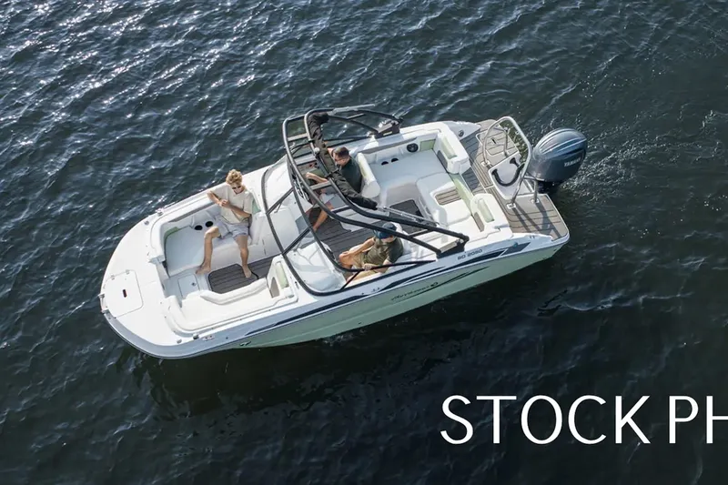 Slide: The Image of 2026 Hurricane SunDeck 2050 OB boat cruising on calm water at sunset, Castaway Marine logo. - 21