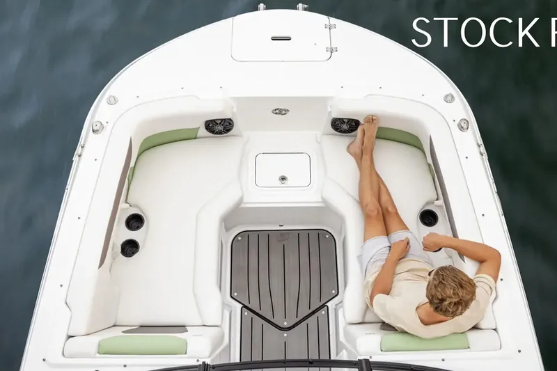 Slide: The Image of 2026 Hurricane SunDeck 2050 OB boat cruising on open water, aerial view. - 22