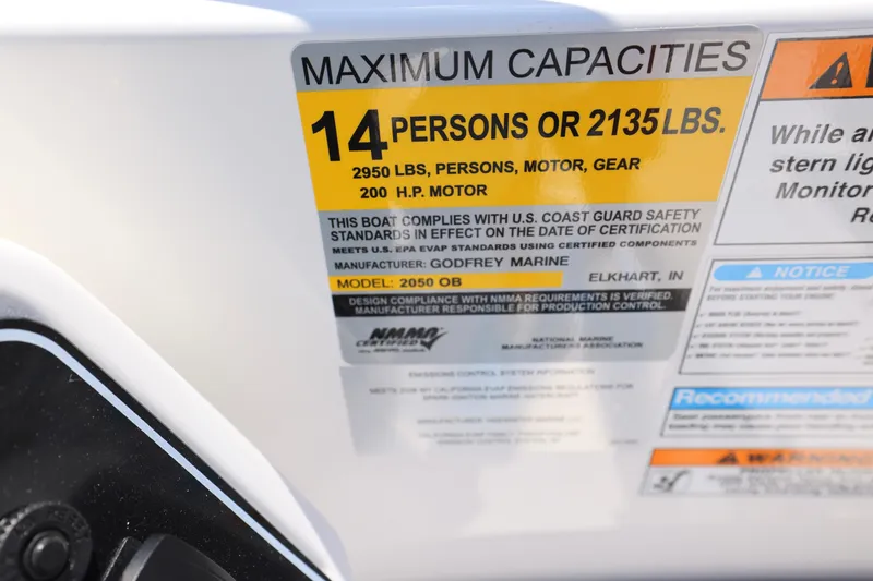 Slide: The Image of 2026 Hurricane SunDeck 2050 OB boat dashboard with steering wheel and control panel. - 6