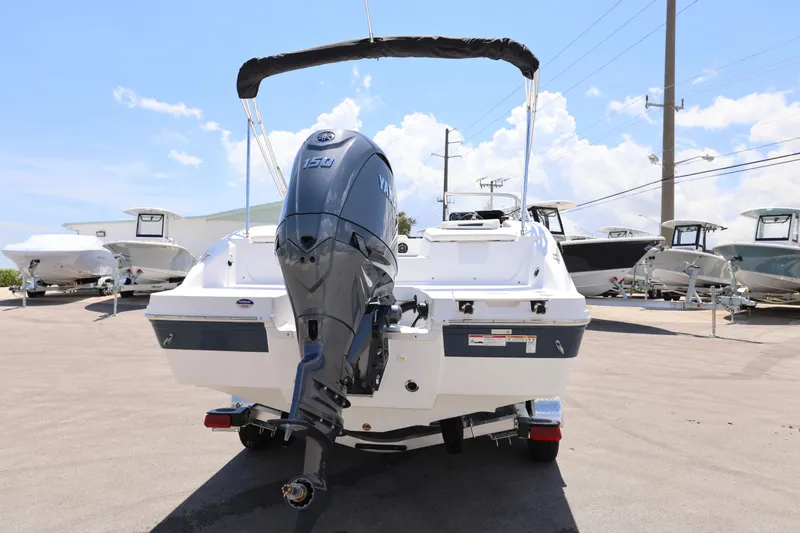 Slide: The Image of 2026 Hurricane SunDeck 2050 OB boat with Yamaha outboard motor on trailer. - 8