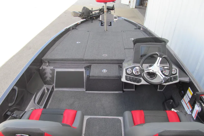 Slide: The Image of 2026 Ranger Z185 boat interior with steering console and red-black seats. - 5