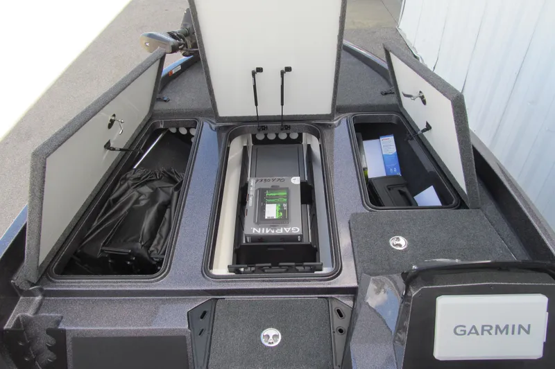 Slide: The Image of 2026 Ranger Z185 boat storage compartments with Garmin electronics and organized gear. - 8