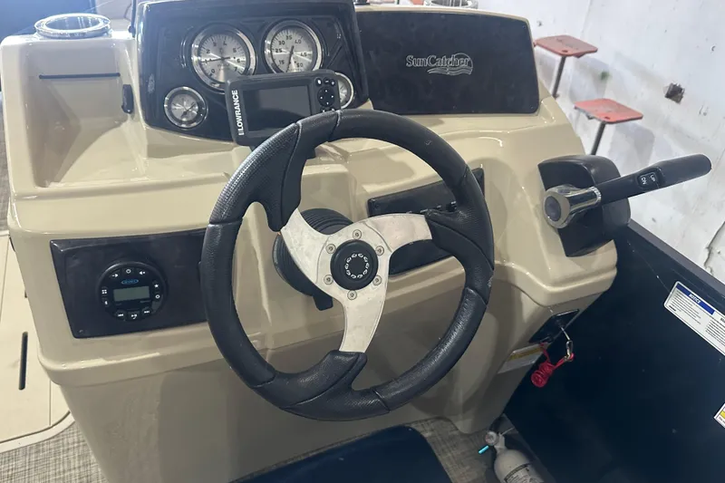 Slide: The Image of Steering console of 2021 SunCatcher Select Series 322C with gauges and controls. - 6