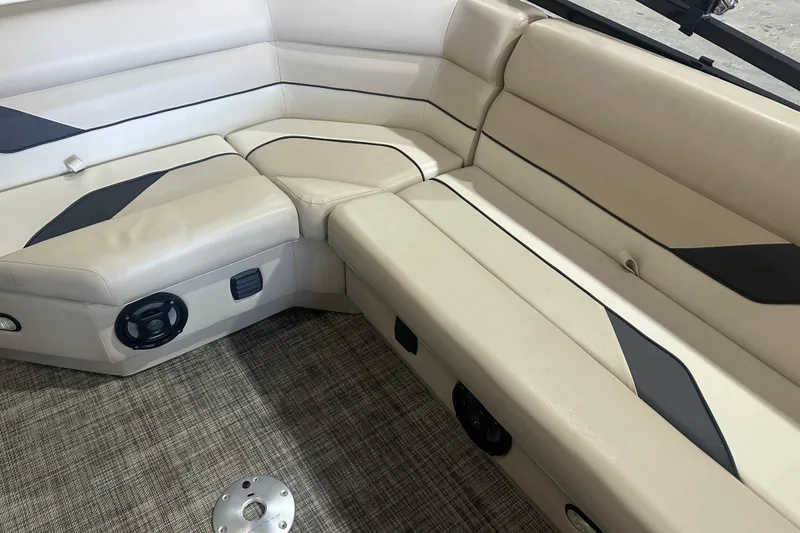 Slide: The Image of 2021 SunCatcher Select Series 322C boat interior with beige seating and modern design. - 8