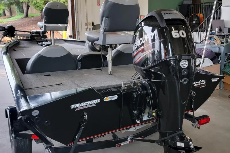 Slide: The Image of 2015 Tracker Pro Team 175 TXW boat with Mercury 60 engine in garage. - 3