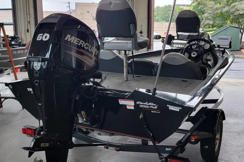 Slide: The Image of 2015 Tracker Pro Team 175 TXW boat with Mercury 60 engine in a garage. - 4