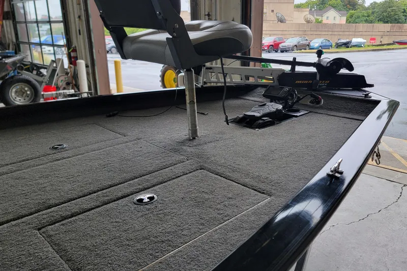 Slide: The Image of 2015 Tracker Pro Team 175 TXW boat interior with fishing seat and equipment. - 6