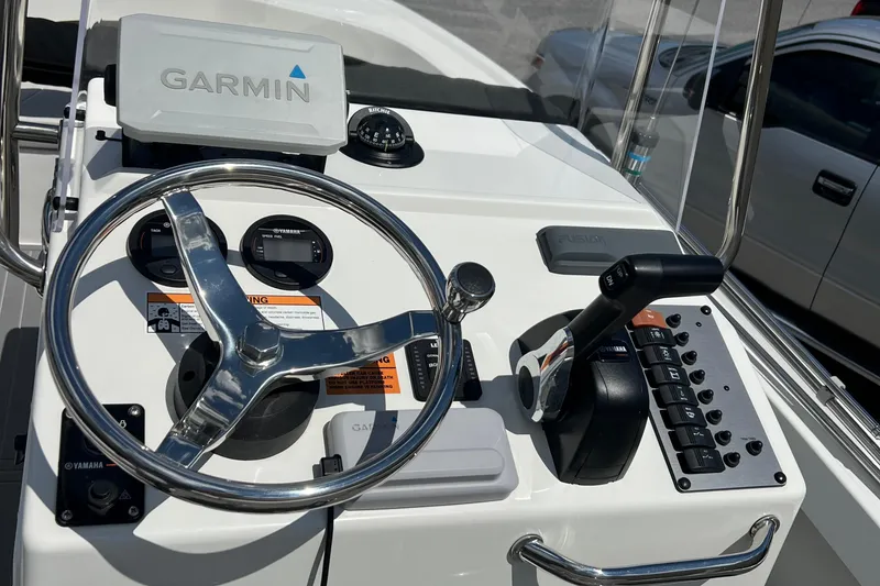 Slide: The Image of 2023 Parker 1801 Center Console boat dashboard with Garmin navigation system. - 13