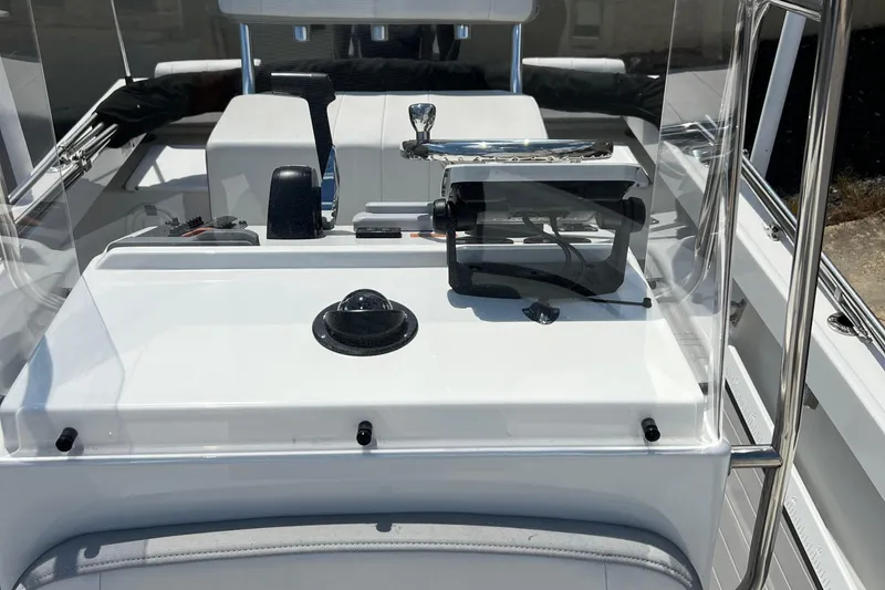 Slide: The Image of 2023 Parker 1801 Center Console boat dashboard with steering and controls. - 20