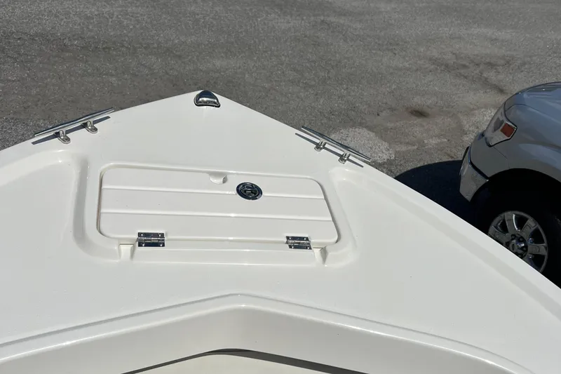 Slide: The Image of 2023 Parker 1801 Center Console boat bow with storage hatch and cleats. - 21