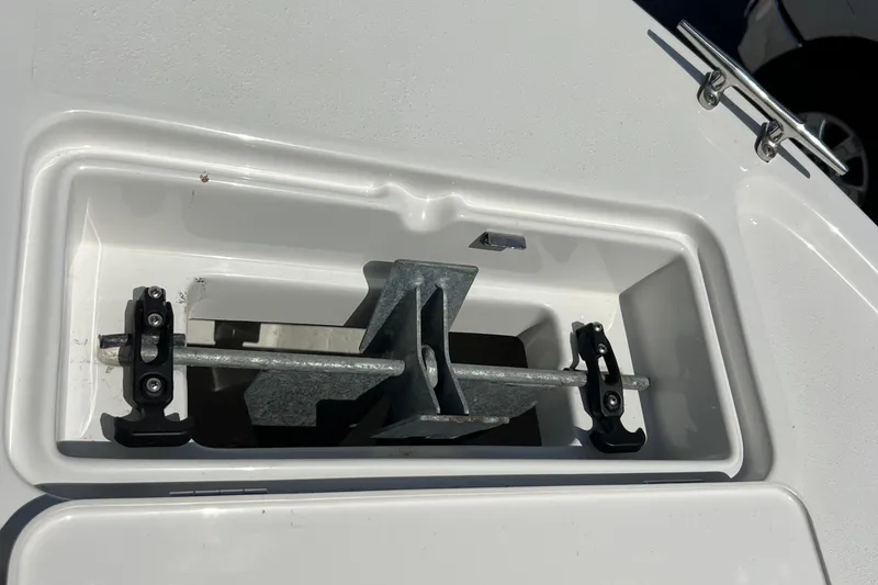 Slide: The Image of 2023 Parker 1801 Center Console anchor storage compartment with metal anchor secured inside. - 22