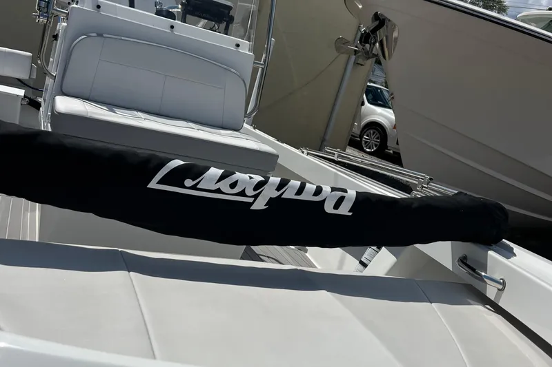 Slide: The Image of 2023 Parker 1801 Center Console boat interior with branded cover and seating. - 4