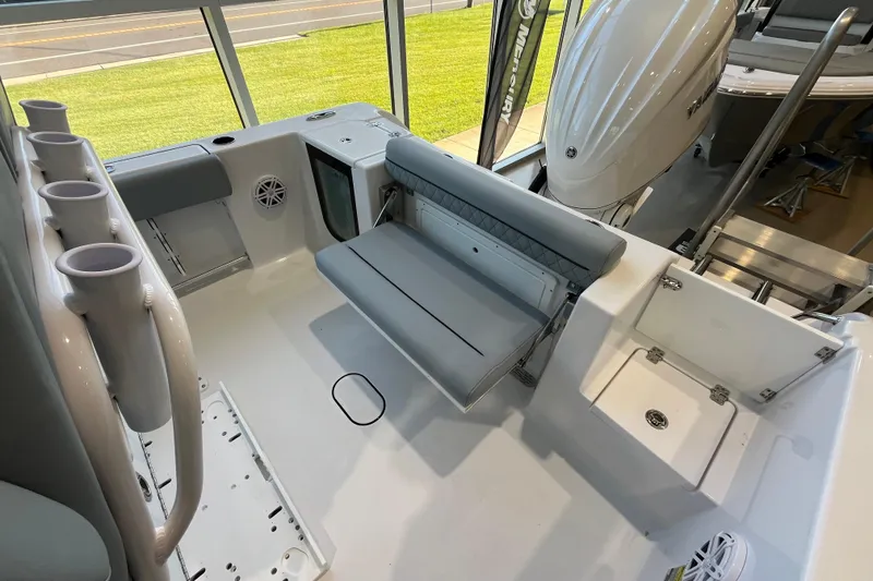 Slide: The Image of 2026 Sportsman Open 232 Center Console boat interior with seating and storage features. - 5
