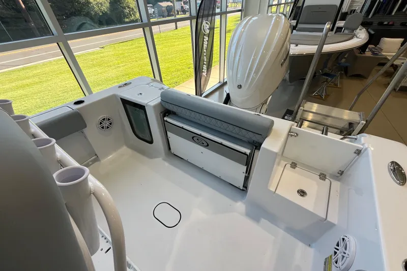 Slide: The Image of 2026 Sportsman Open 232 Center Console boat interior with seating and storage. - 6