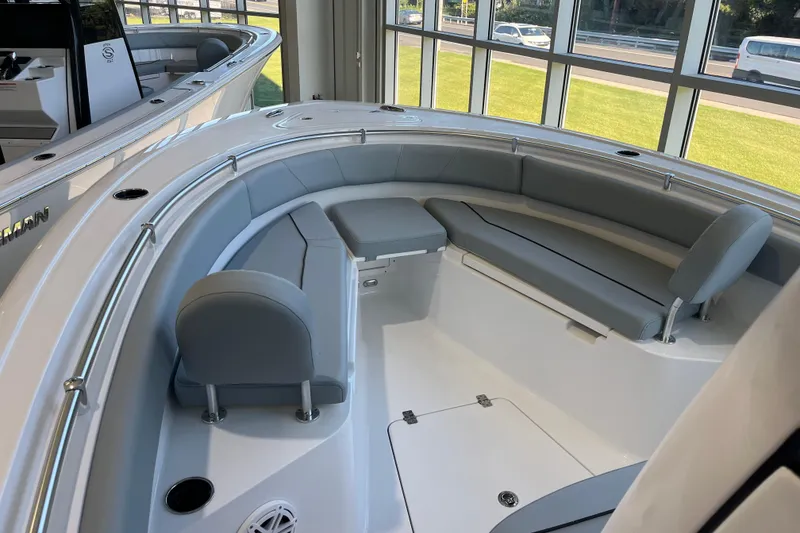 Slide: The Image of 2026 Sportsman Open 232 Center Console boat interior with gray seating and modern design. - 8