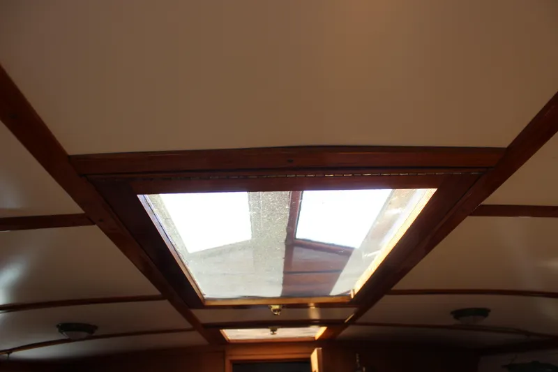 Slide: The Image of Interior view of 1988 Express Yachting Scout 30 with wooden-framed skylight. - 19