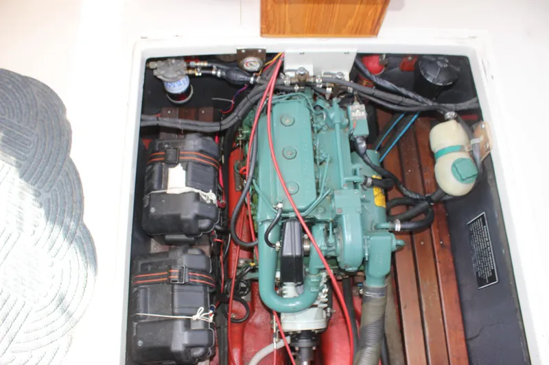 Slide: The Image of Engine compartment of 1988 Express Yachting Scout 30 with visible components and wiring. - 28