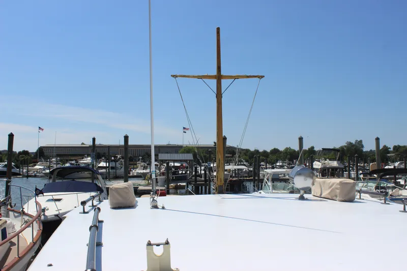 Slide: The Image of 1988 Express Yachting Scout 30 docked at marina under clear blue sky. - 42