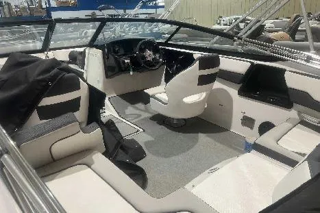 Slide: The Image of 2023 Yamaha Boats SX195 interior with modern seating and sleek dashboard design. - 4
