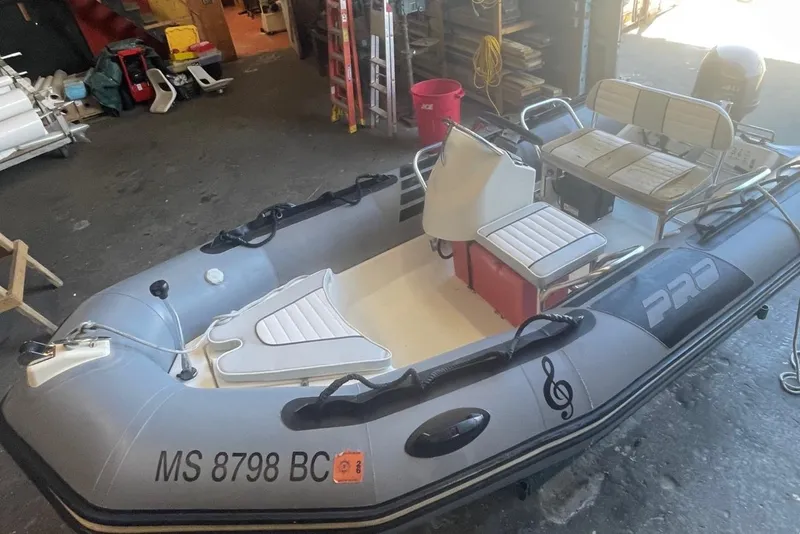 Slide: The Image of 2014 Zodiac Bayrunner 420 inflatable boat in a garage setting. - 3