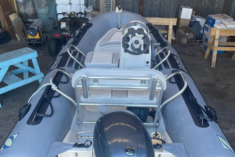 Slide: The Image of 2014 Zodiac Bayrunner 420 inflatable boat in a storage area. - 6