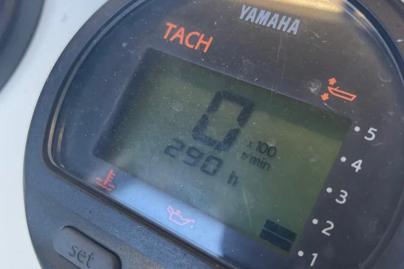 Slide: The Image of Tachometer display on a 2014 Zodiac Bayrunner 420 boat, showing 290 hours. - 7