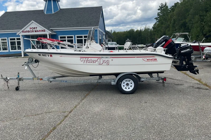 Slide: The Image of 2000 Boston Whaler Dauntless 16 boat on trailer at Port Harbor Marine. - 4