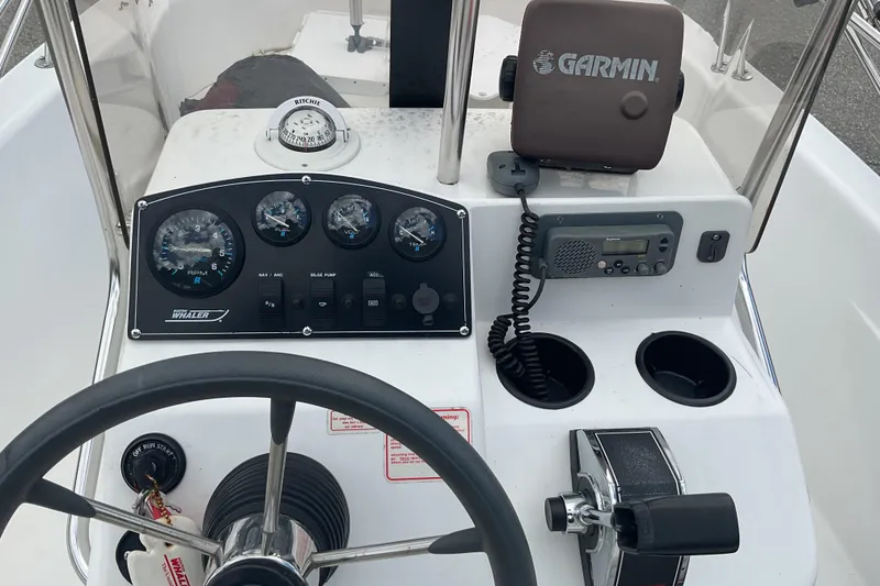 Slide: The Image of Control panel of a 2000 Boston Whaler Dauntless 16 boat with Garmin GPS. - 9