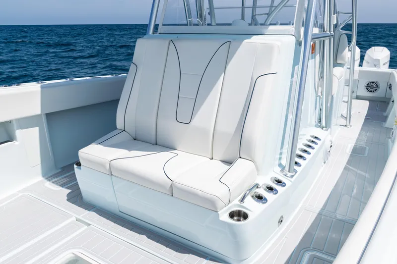 Slide: The Image of 2023 SeaVee 390Z boat on open water, showcasing sleek deck design and ocean view. - 10