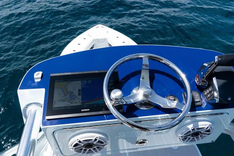 Slide: The Image of 2023 SeaVee 390Z boat with rod holders, ocean view, and clear blue sky. - 16
