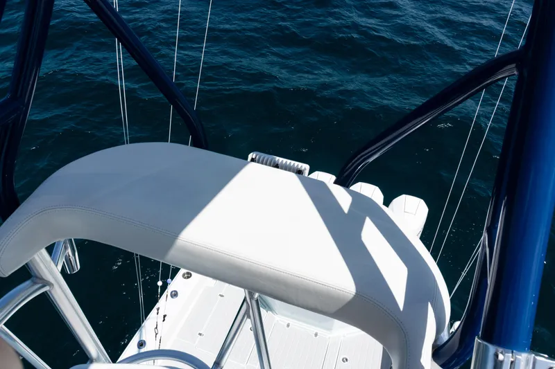 Slide: The Image of 2023 SeaVee 390Z boat helm with Garmin display and steering wheel on open water. - 17
