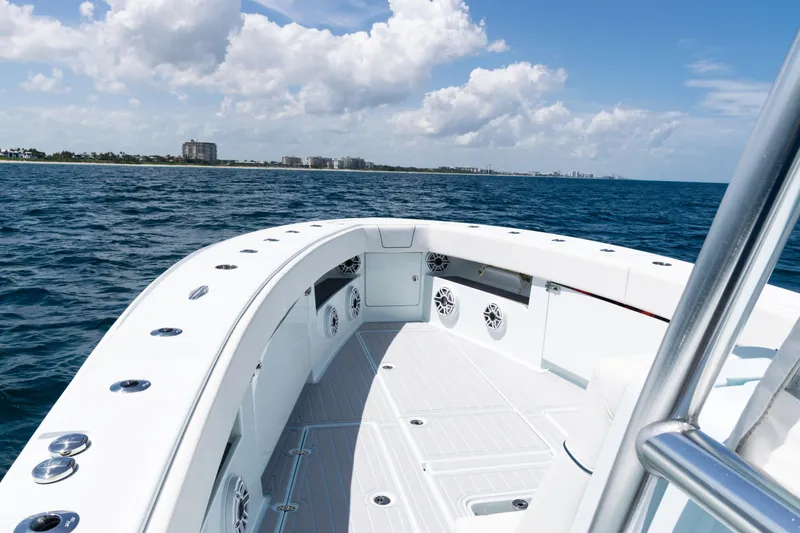 Slide: The Image of 2023 SeaVee 390Z boat interior with rod holders and ocean view. - 24