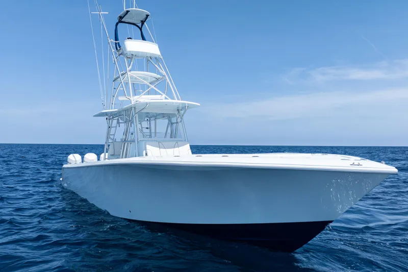 Slide: The Image of 2023 SeaVee 390Z boat on open ocean, clear sky, side view. - 3
