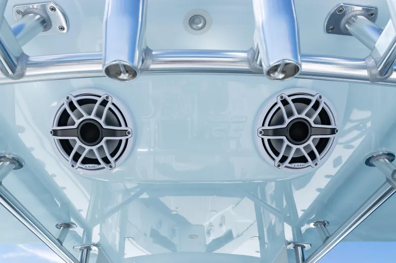Slide: The Image of 2023 SeaVee 390Z boat tower with rod holders and speakers against blue sky. - 34