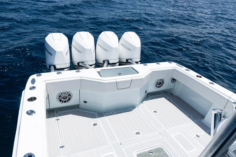 Slide: The Image of 2023 SeaVee 390Z boat with four Mercury engines on open ocean. - 36