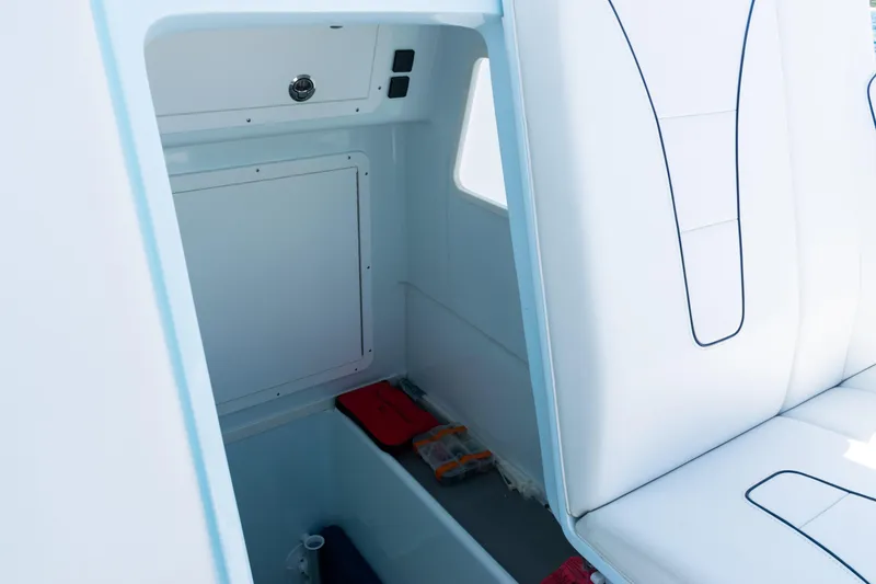 Slide: The Image of 2023 SeaVee 390Z boat with four Mercury outboard engines on open water. - 37