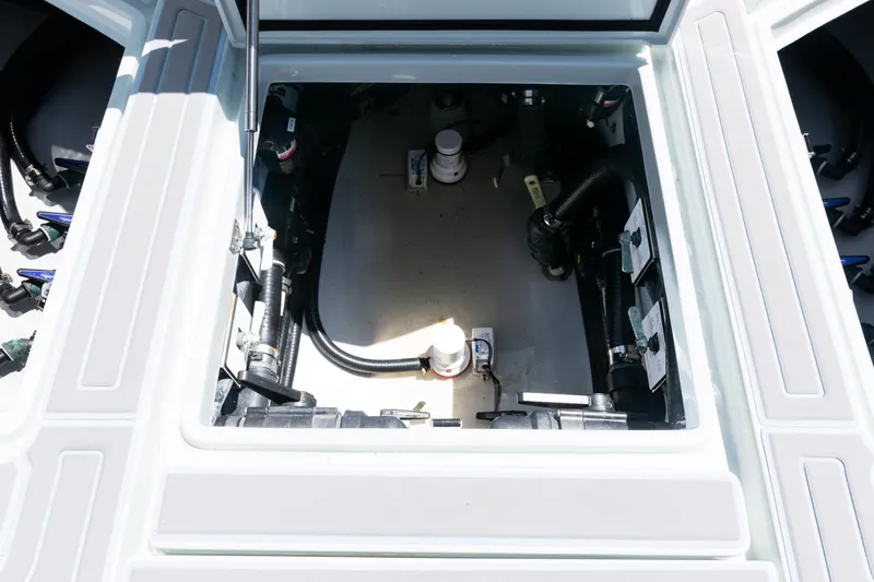 Slide: The Image of 2023 SeaVee 390Z boat interior storage compartment with white seating. - 38