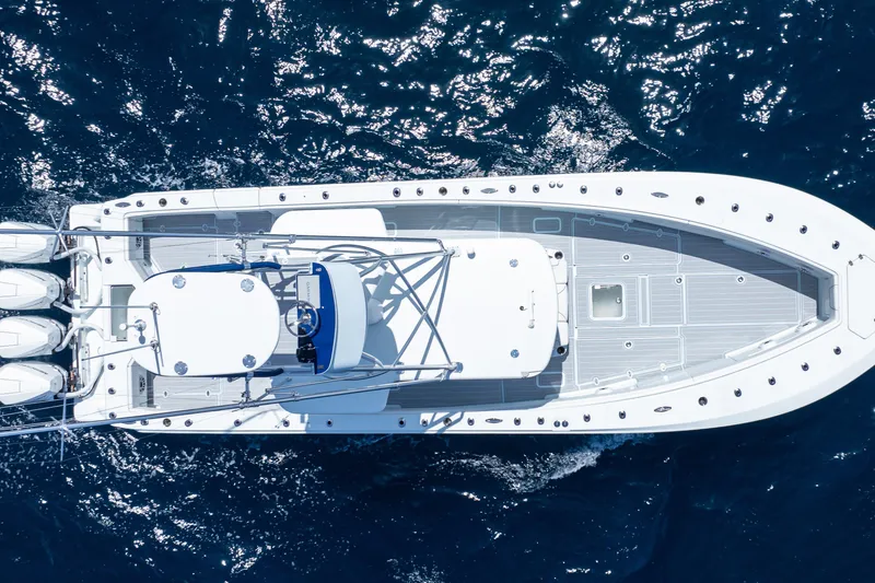 Slide: The Image of 2023 SeaVee 390Z boat on open ocean, featuring sleek design and powerful engines. - 4