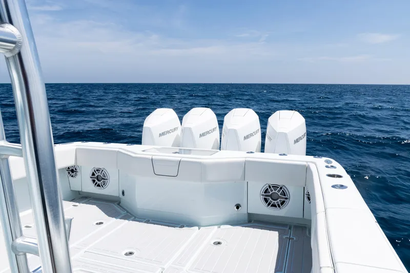 Slide: The Image of 2023 SeaVee 390Z boat with Mercury engines, ocean view, and city skyline in the background. - 42