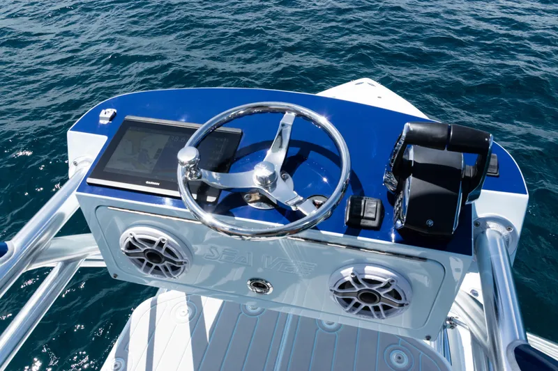 Slide: The Image of 2023 SeaVee 390Z boat with four Mercury engines, ocean view in the background. - 44