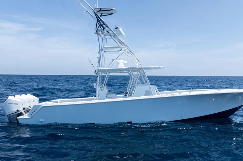 Slide: The Image of 2023 SeaVee 390Z boat on open ocean, featuring sleek design and powerful engines. - 48