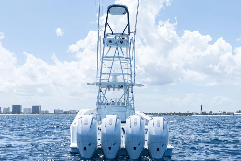 Slide: The Image of 2023 SeaVee 390Z boat on open ocean, featuring Mercury engines and sleek design. - 49