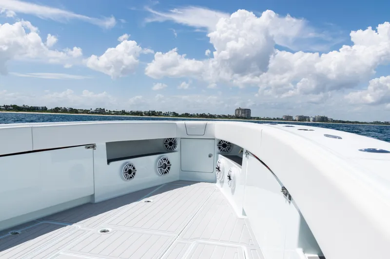 Slide: The Image of 2023 SeaVee 390Z boat on open ocean under clear blue sky. - 5