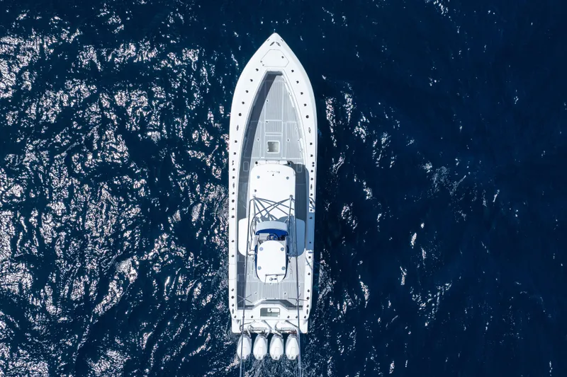 Slide: The Image of Aerial view of 2023 SeaVee 390Z boat cruising on deep blue ocean waters. - 51