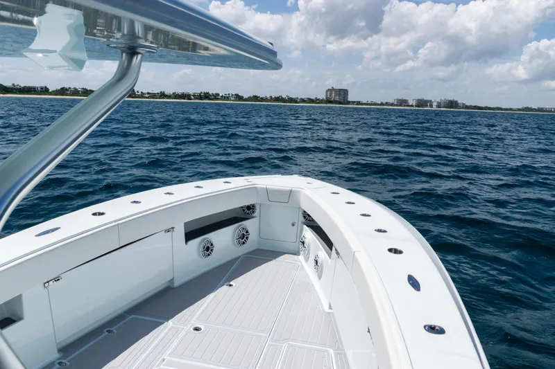 Slide: The Image of 2023 SeaVee 390Z boat deck with clear sky and modern design. - 58