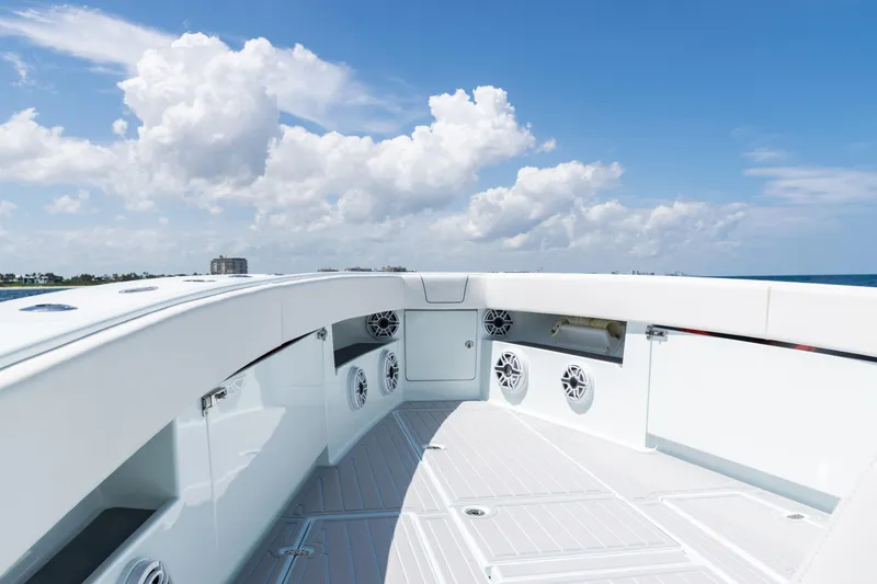 Slide: The Image of 2023 SeaVee 390Z boat deck with speakers, ocean view, and blue sky. - 6