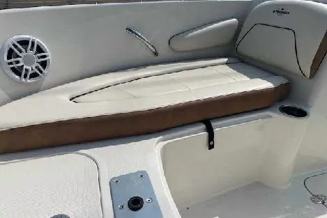 Slide: The Image of 2024 Stingray 172SC boat interior with cushioned seating and speaker. - 2